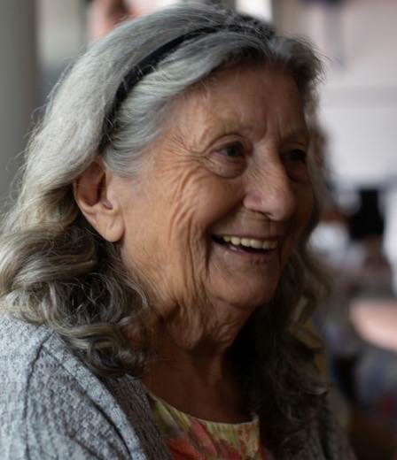 An elderly patient at home, smiling